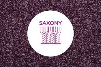 Cross section of cut pile yarns in a saxony carpet on a neutral carpet background